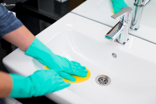Upholstery cleaning equipment used on a residential sofa