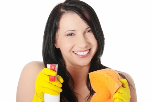 End of tenancy cleaning tasks in a Colliers Wood apartment including bathroom and kitchen surfaces