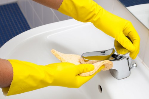 Local cleaning team working in a Colliers Wood flat during a move-out clean